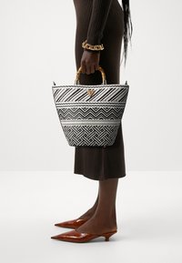 Guess HAPPYLAND TOTE - Handbag - جيس حقيبة يد هابي لاند توت